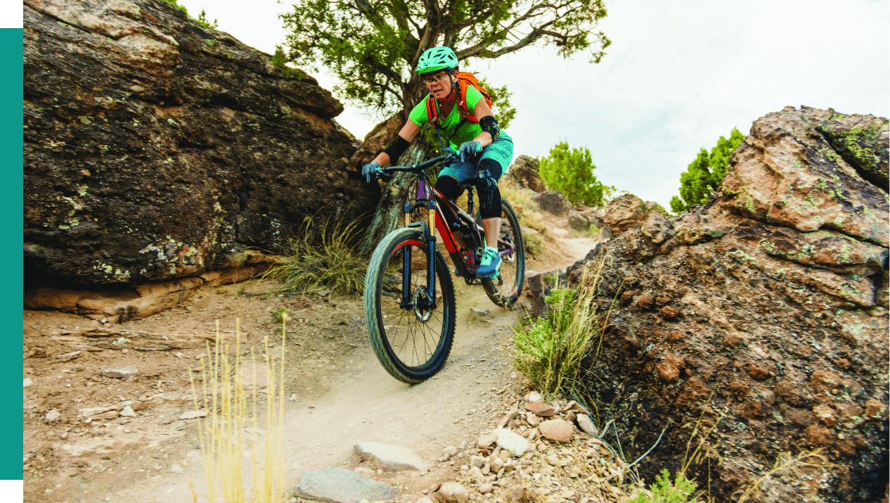 Woman biking on trail